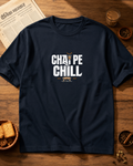 Navy blue t-shirt with 'Chai Pe Chill' text on a wooden table with snacks and a newspaper.