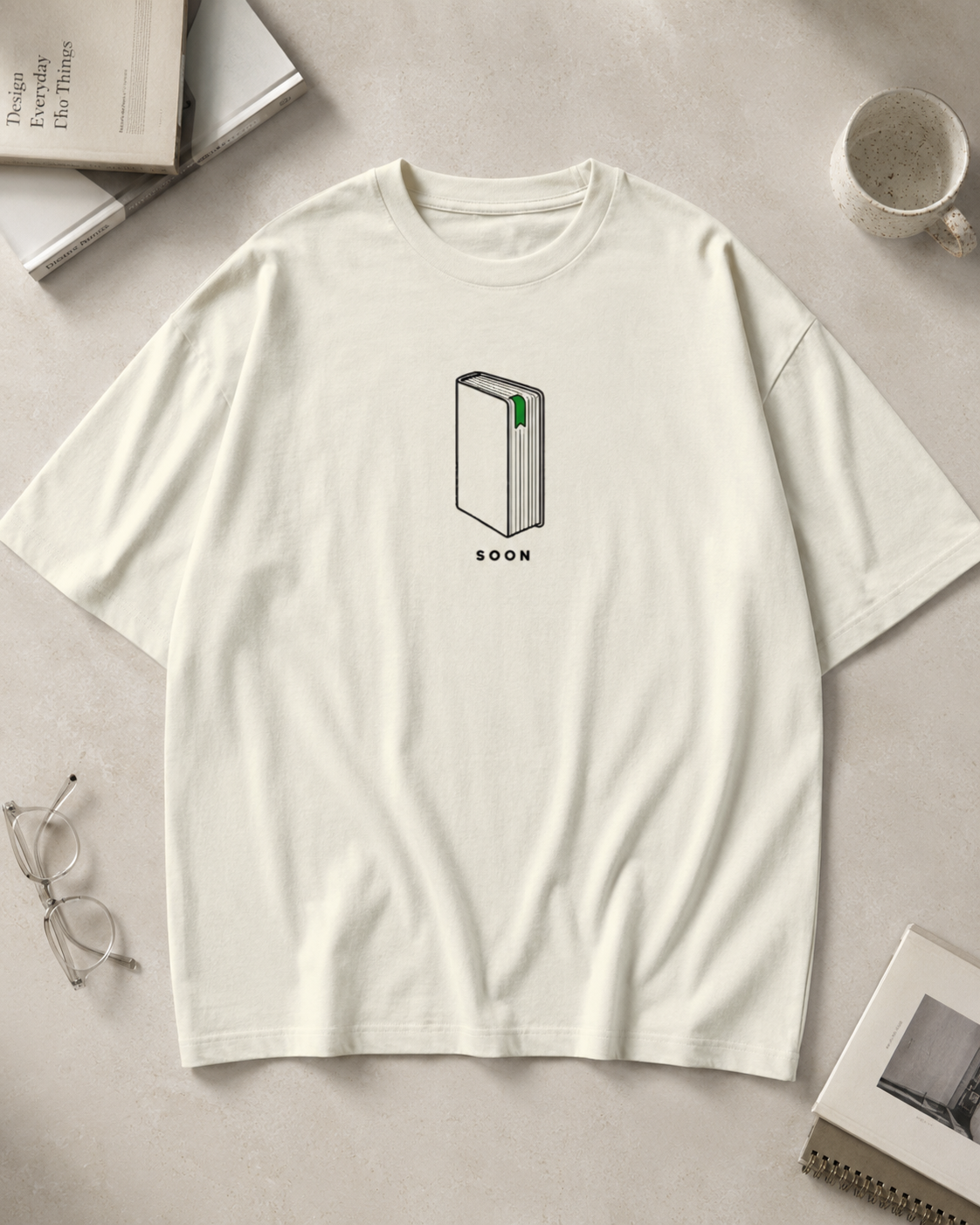 Bookmark on Page Three Oversized Graphic T-Shirt color options in Gray and Cream